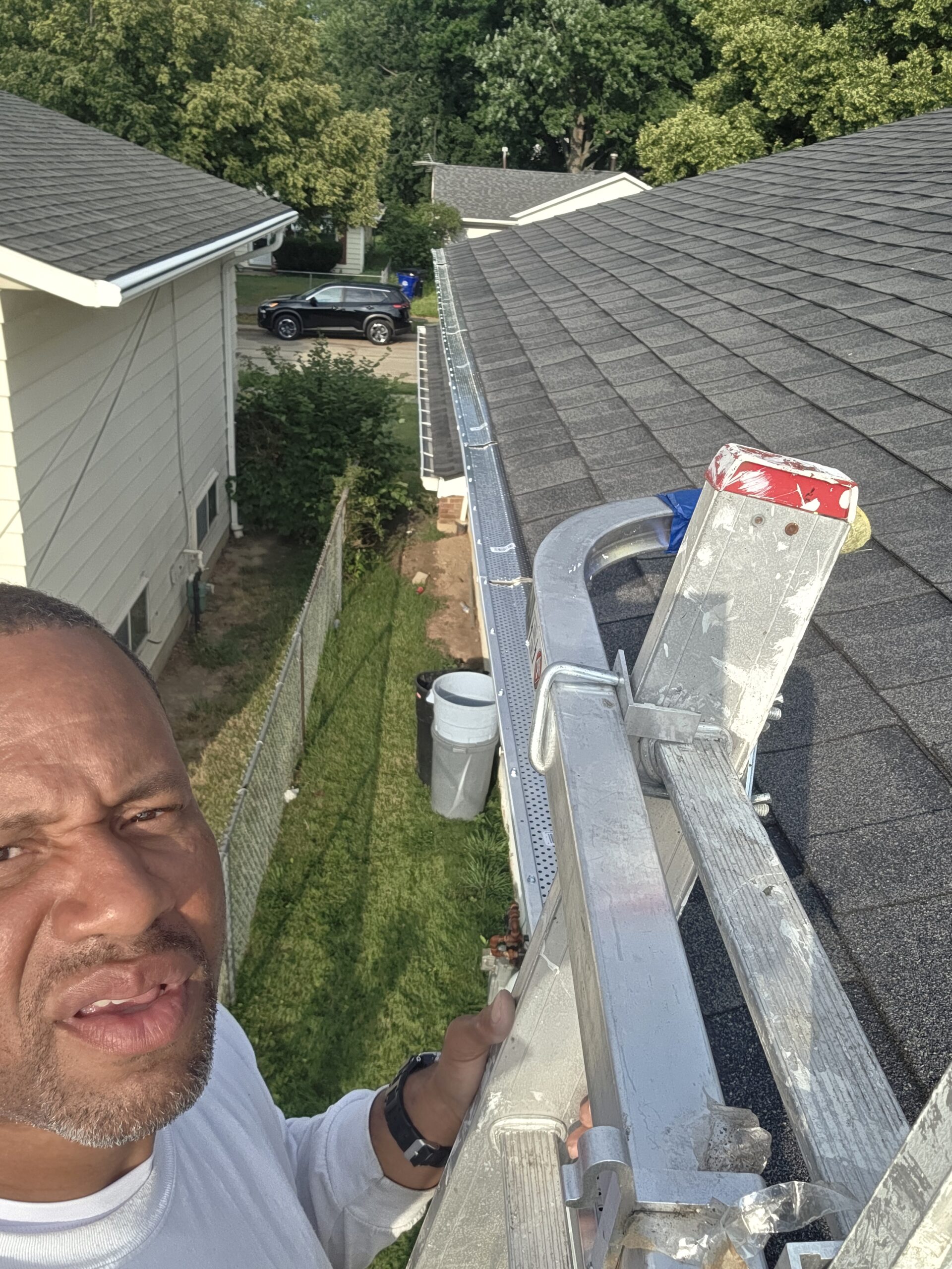 Contractor Installing gutter guards in Euclid Ohio.